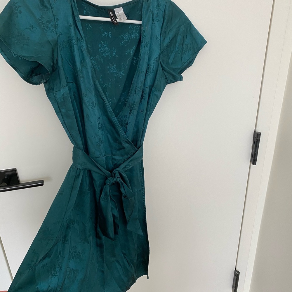 Emerald green wrap dress with floral detailing